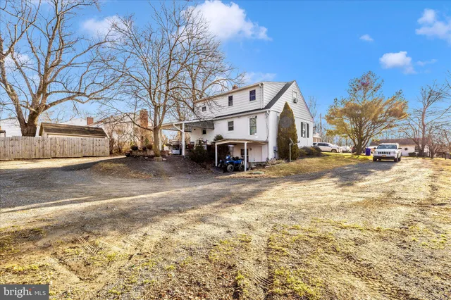 a view of a car park in front of house