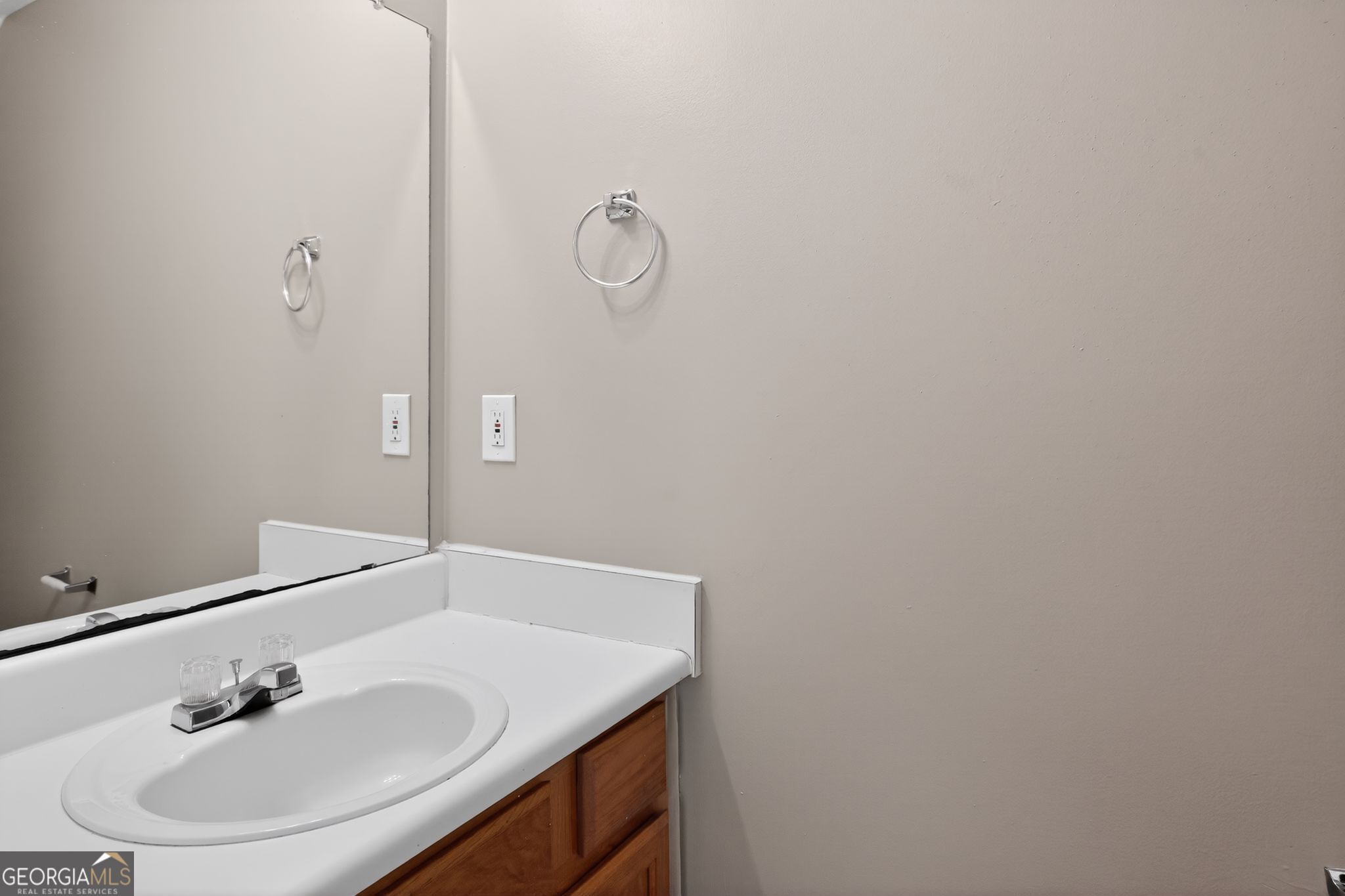 1931 Cornell Way Morrow, GA 30260 - Photo 24 of 33 a bathroom with a sink and a mirror
