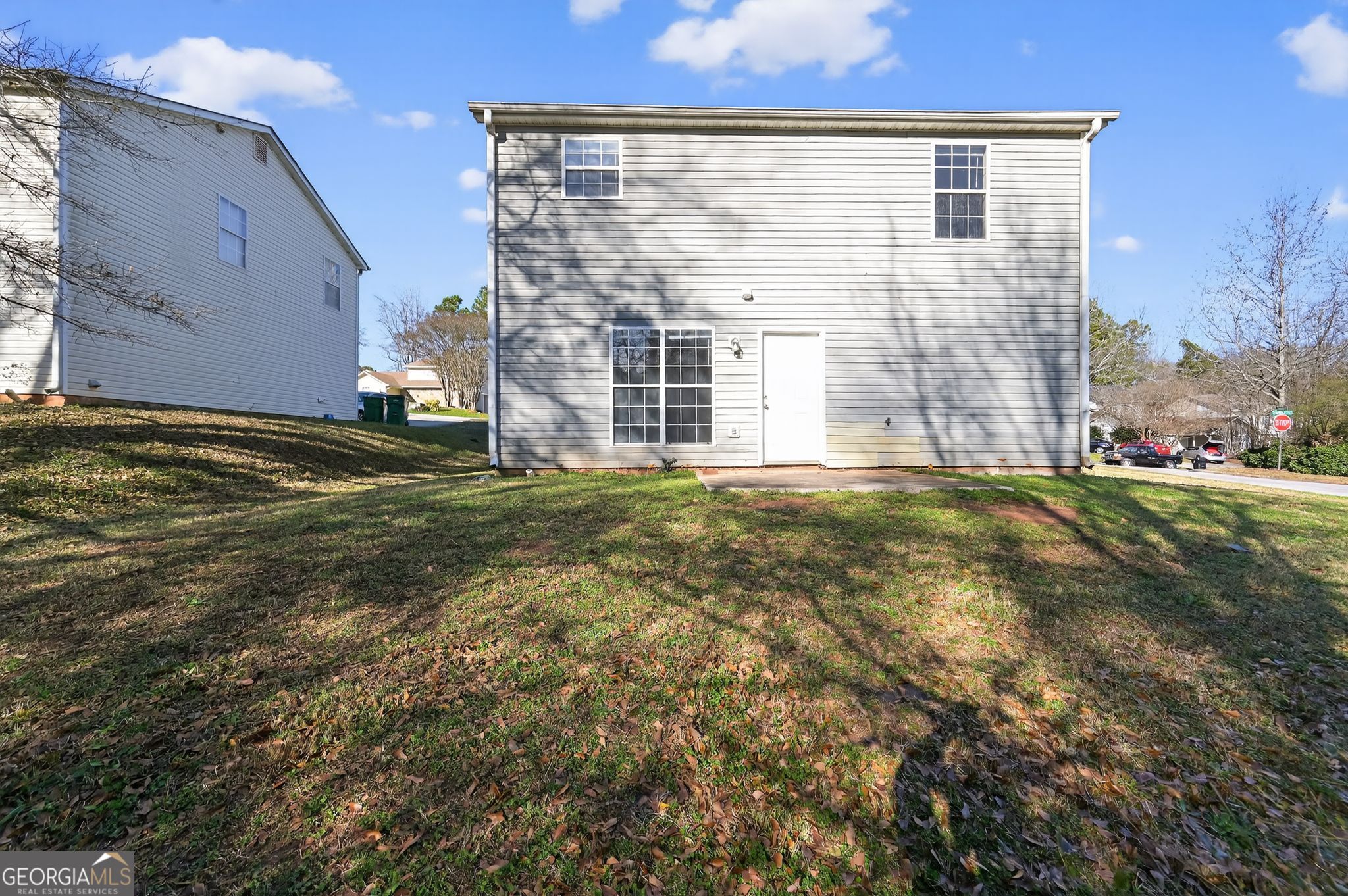 1931 Cornell Way Morrow, GA 30260 - Photo 29 of 33 a view of a big house with a big yard and large tree