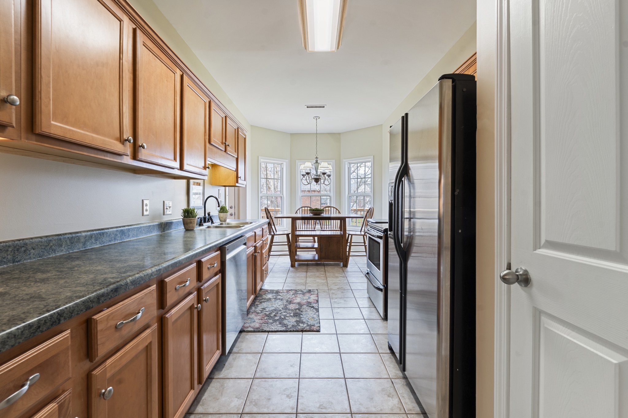 2611 Mission Ridge Drive Murfreesboro, TN 37130 - Photo 11 of 27 a kitchen with stainless steel appliances granite countertop a refrigerator and a sink