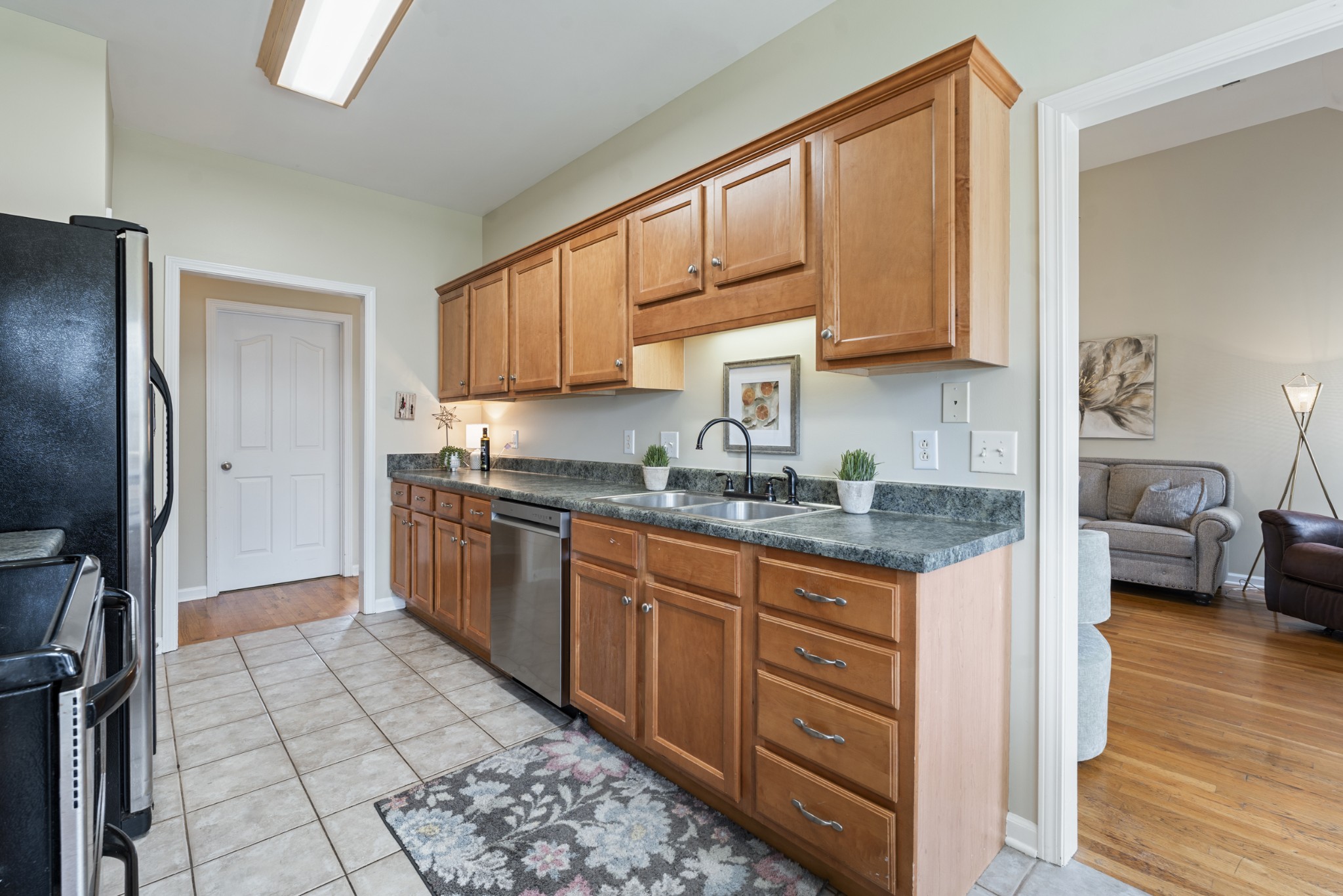 2611 Mission Ridge Drive Murfreesboro, TN 37130 - Photo 13 of 27 a kitchen with stainless steel appliances granite countertop a stove a sink and a refrigerator