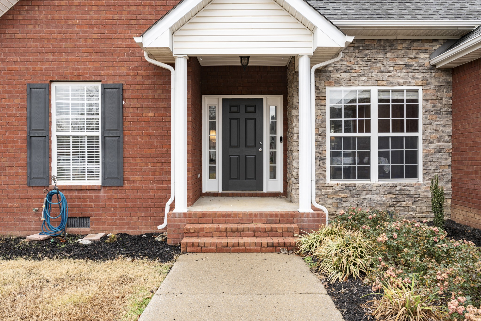 2611 Mission Ridge Drive Murfreesboro, TN 37130 - Photo 5 of 27 a front view of a house with a yard