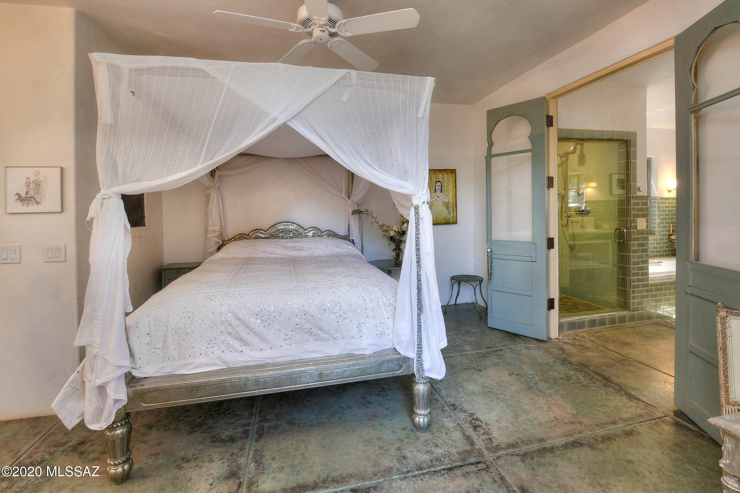 360 Harshaw Creek Road Patagonia, AZ 85624 - Photo 25 of 50 a bedroom with a bed and a mirror
