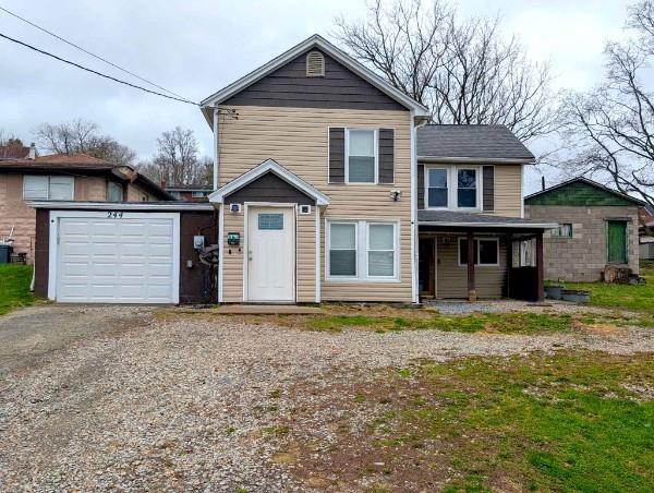 244 North Main Street Houston, PA 15342 - Photo 1 of 3 a view of a house with a yard and large tree