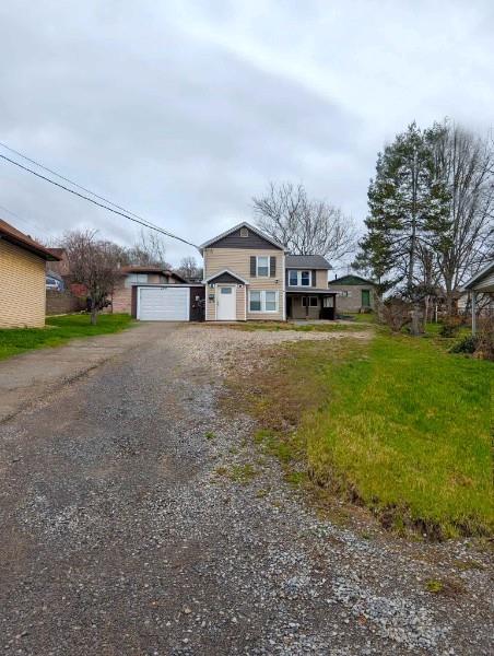 244 North Main Street Houston, PA 15342 - Photo 3 of 3 a front view of house with yard and trees