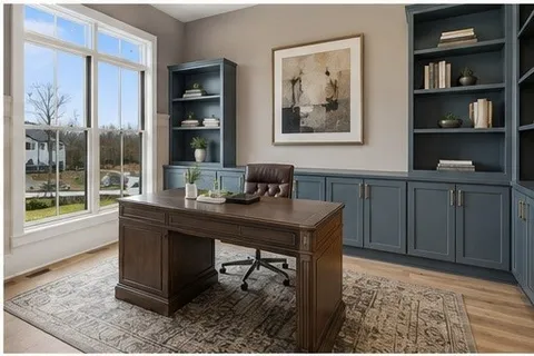 a view of a workspace with furniture