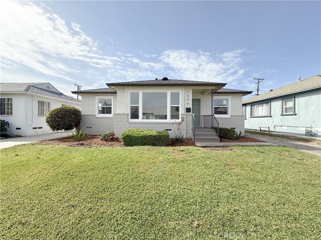 1506 West Stockwell Street Compton, CA 90222 - Photo 2 of 20 a view of a house with swimming pool and a yard
