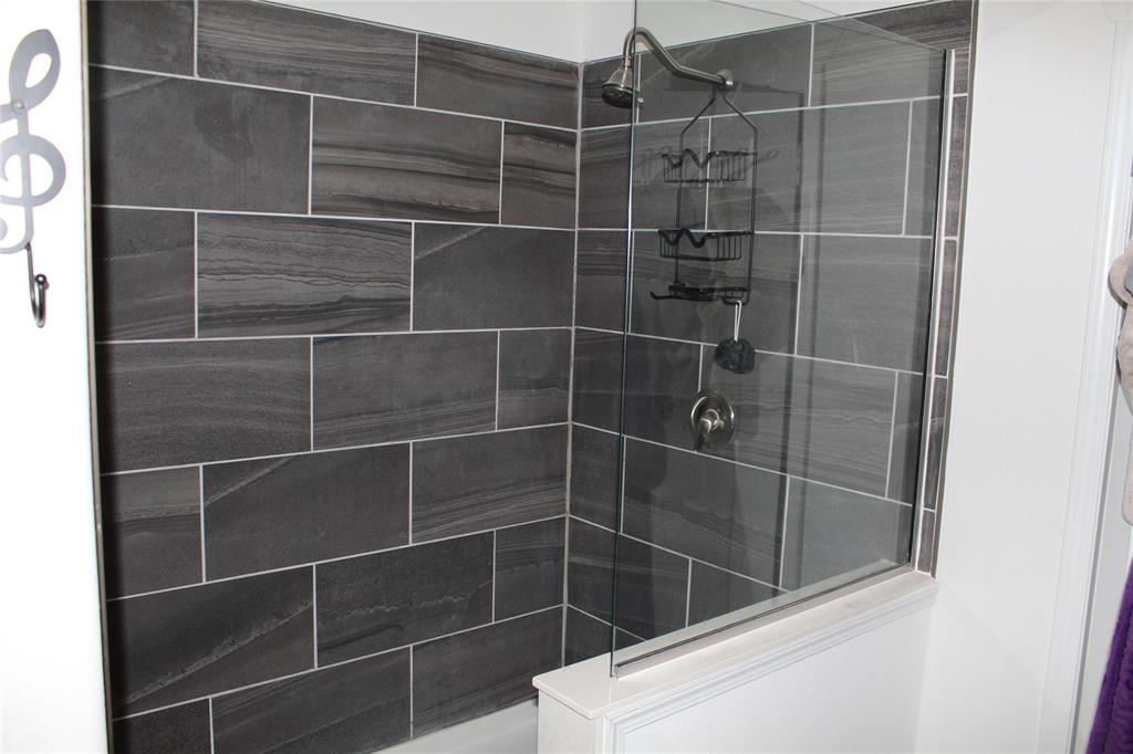 2077 A Shawver Road Perrin, TX 76486 - Photo 14 of 35 a bathroom with a shower