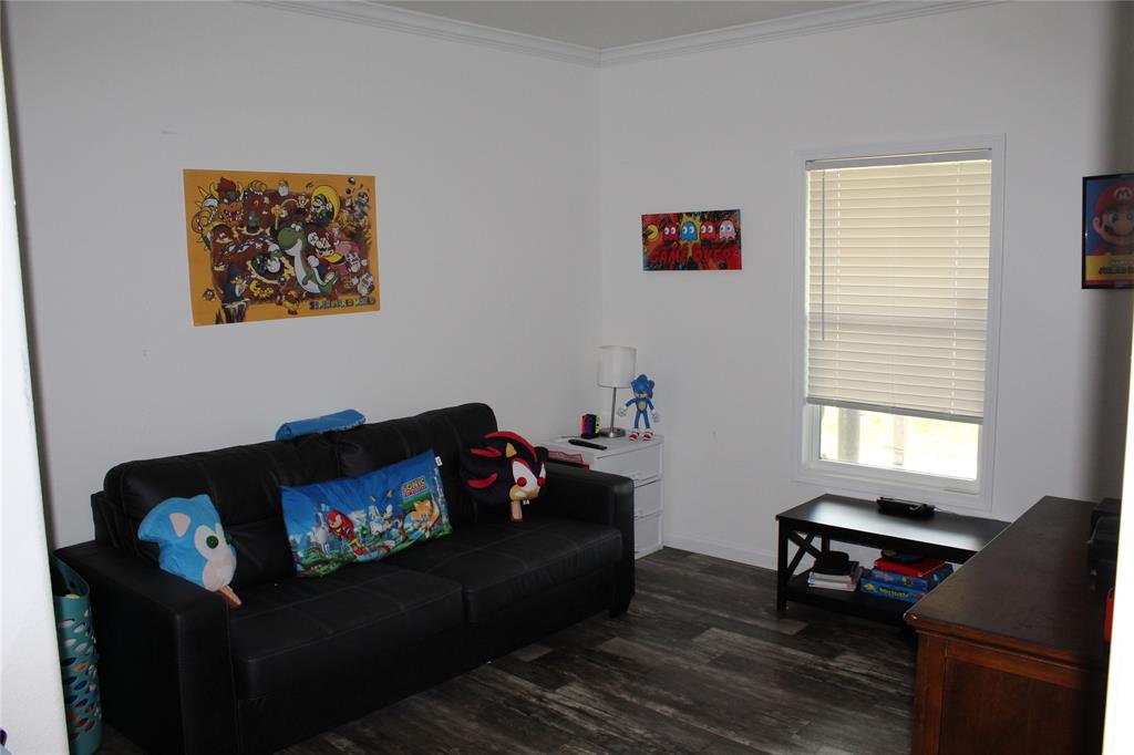 2077 A Shawver Road Perrin, TX 76486 - Photo 15 of 35 a living room with furniture and a window