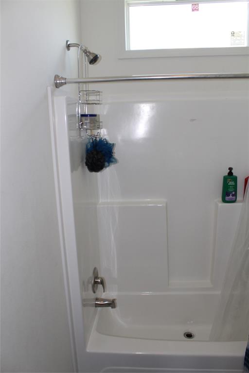2077 A Shawver Road Perrin, TX 76486 - Photo 20 of 35 a bathroom with a bathtub