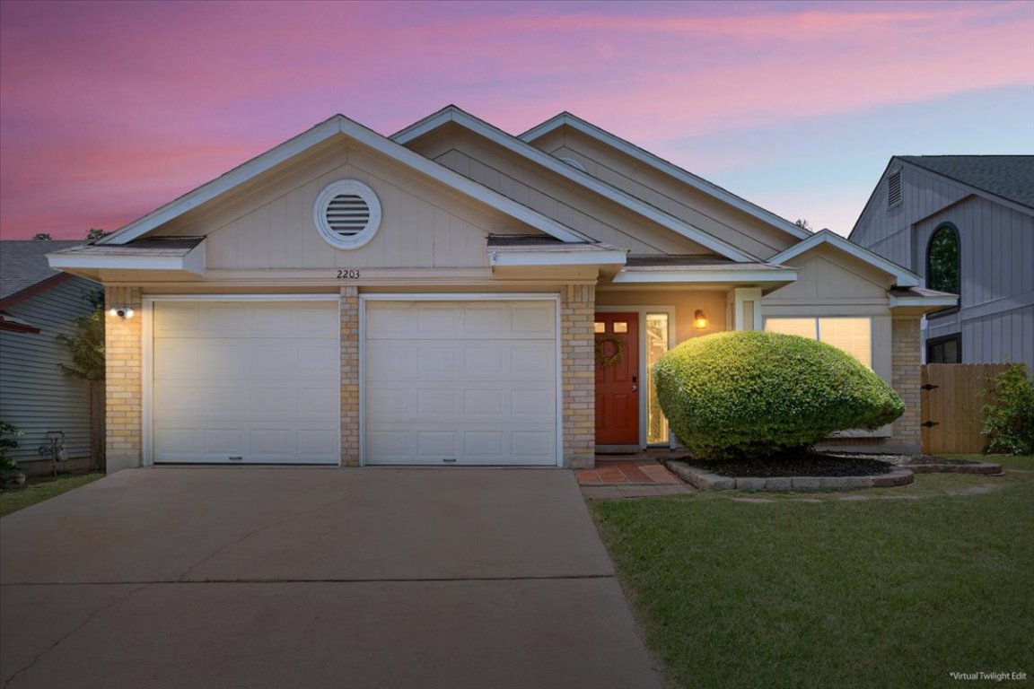 2203 Nathan Drive Austin, TX 78728 - Photo 1 of 1 a front view of a house with a yard