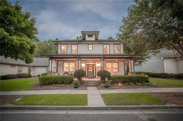 an empty room with potted plants in front of door