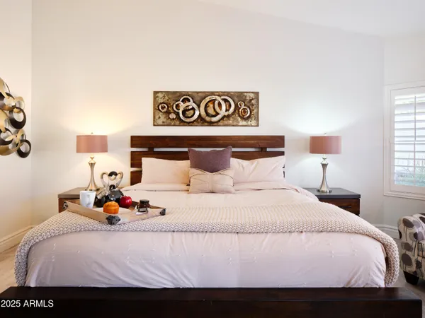 a spacious bathroom with a tub sink and shower