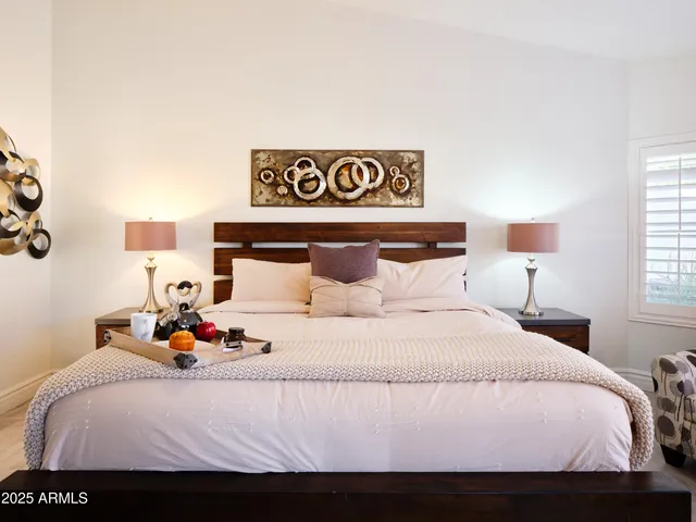 a spacious bathroom with a tub sink and shower
