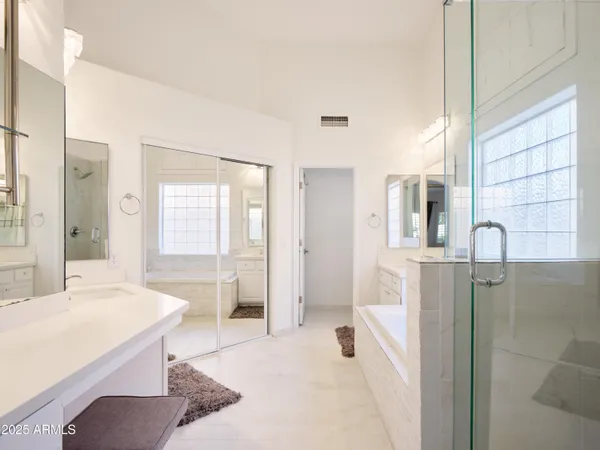 a bathroom with a bathtub and a sink