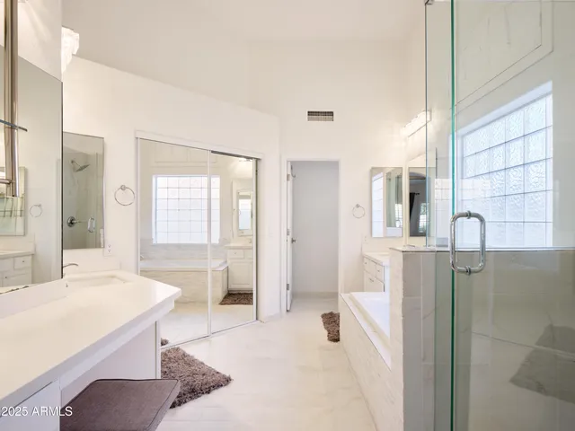a bathroom with a bathtub and a sink