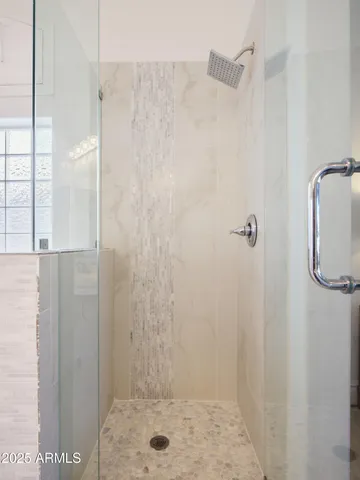 a spacious bedroom with a bed and window