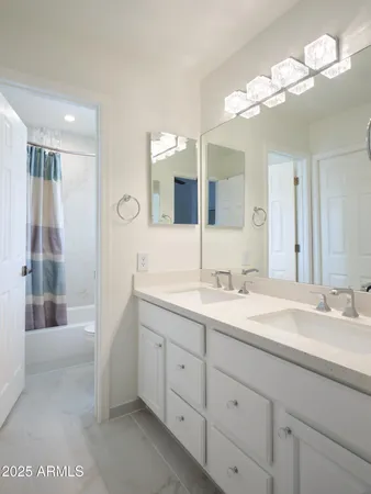 a bathroom with a shower a toilet and a tub