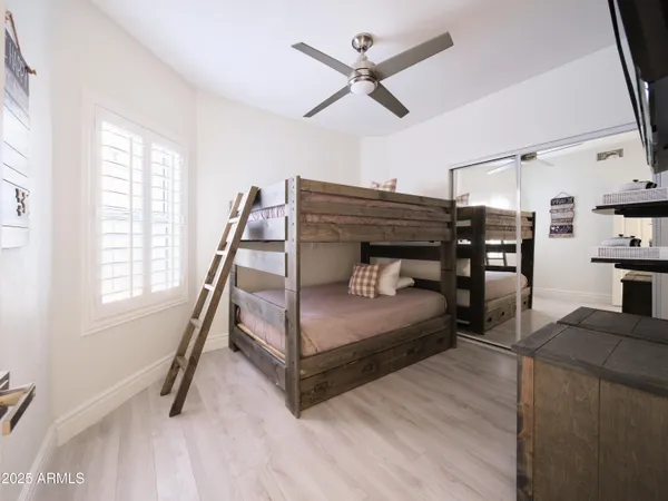 a hallway with a potted plant on the wall