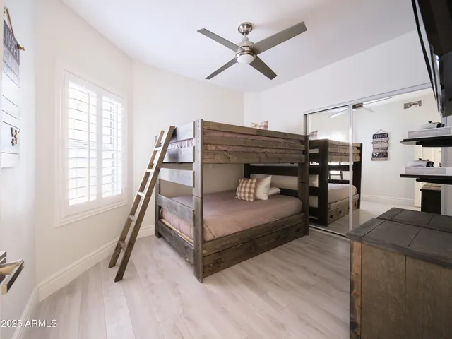 a hallway with a potted plant on the wall