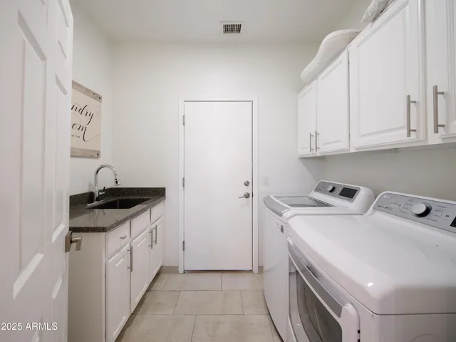 a view of a house with swimming pool and sitting area
