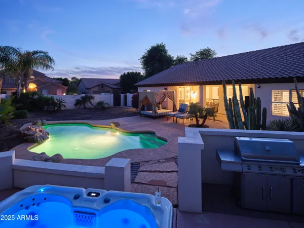 a swimming pool with outdoor seating