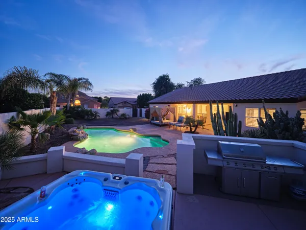 a swimming pool with outdoor seating and yard