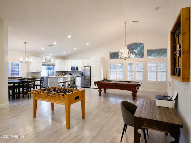 a room with lots of furniture and view of living room