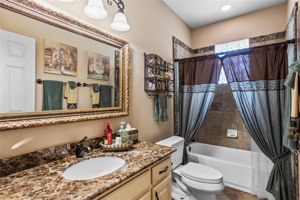 110 Bent Creek Ranch Court Fort Worth, TX 76126 - Photo 16 of 40 a bathroom with a sink toilet and shower
