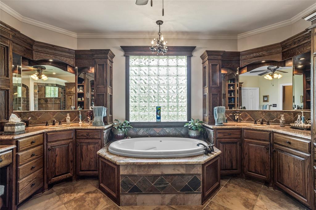 110 Bent Creek Ranch Court Fort Worth, TX 76126 - Photo 18 of 40 a bathroom with a sink and a mirror