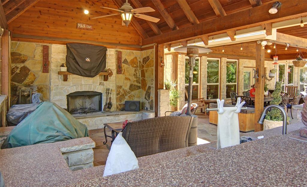 110 Bent Creek Ranch Court Fort Worth, TX 76126 - Photo 21 of 40 a living room with furniture and a fireplace