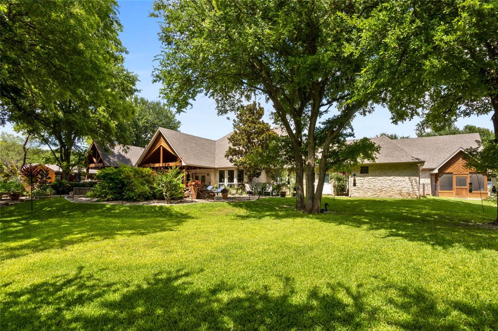 110 Bent Creek Ranch Court Fort Worth, TX 76126 - Photo 27 of 40 a front view of a house with yard and green space