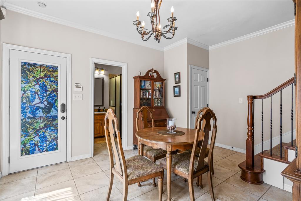 110 Bent Creek Ranch Court Fort Worth, TX 76126 - Photo 31 of 40 a view of a dining room with furniture and a chandelier