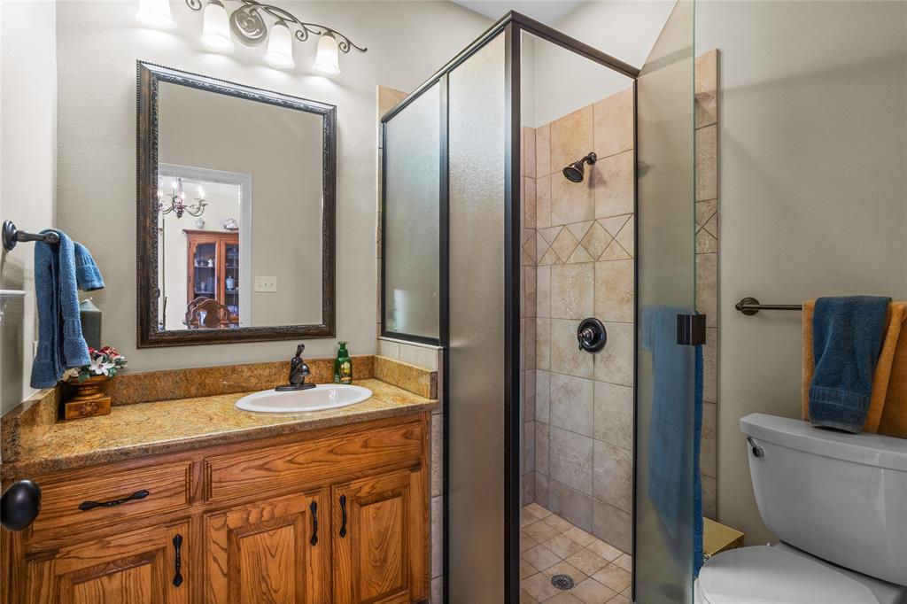 110 Bent Creek Ranch Court Fort Worth, TX 76126 - Photo 33 of 40 a bathroom with a double vanity sink and mirror with shower
