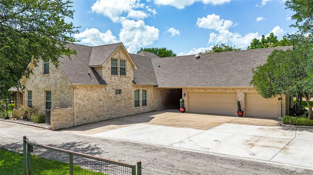 110 Bent Creek Ranch Court Fort Worth, TX 76126 - Photo 35 of 40 a front view of a house with a yard and garage