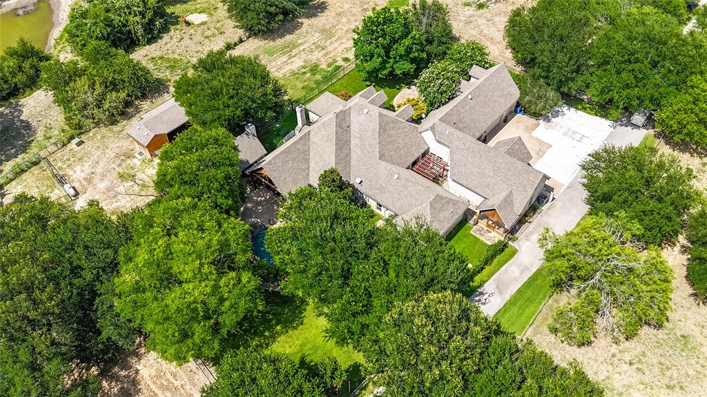 110 Bent Creek Ranch Court Fort Worth, TX 76126 - Photo 37 of 40 an aerial view of a house with swimming pool and garden space