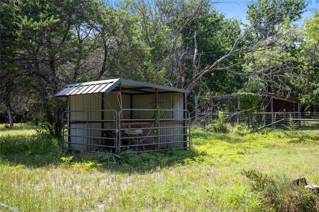 110 Bent Creek Ranch Court Fort Worth, TX 76126 - Photo 40 of 40 a backyard of a house with plants and trees