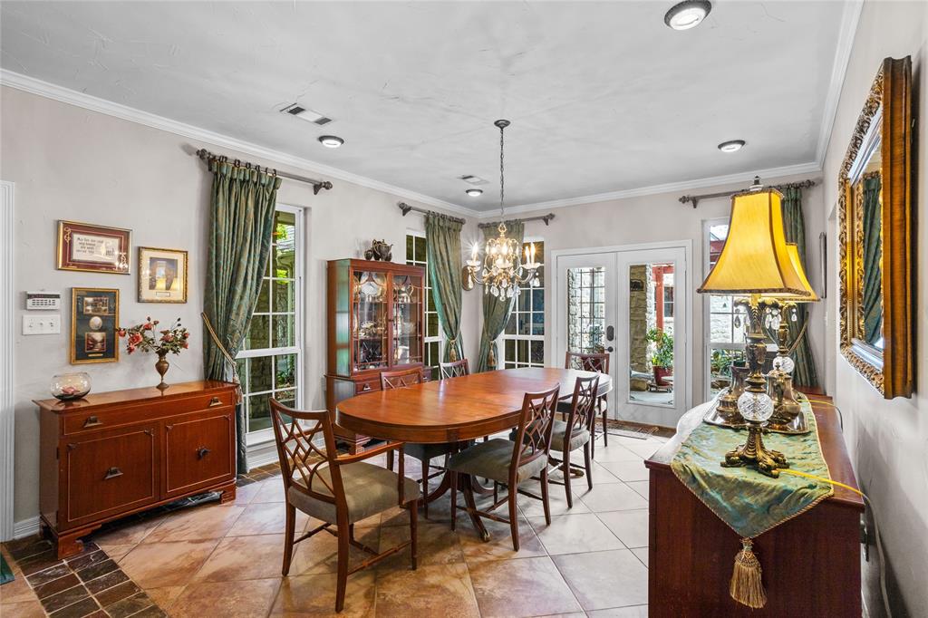 110 Bent Creek Ranch Court Fort Worth, TX 76126 - Photo 6 of 40 a view of a dining room with furniture and chandelier