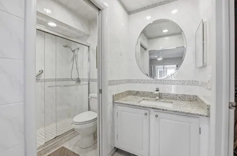 a bathroom with a shower and toilet