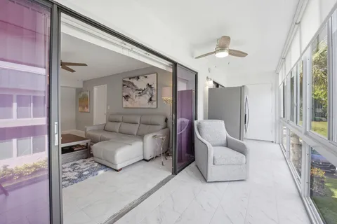 a view of balcony with furniture