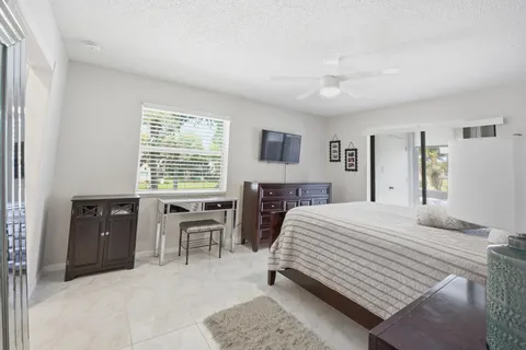 a bedroom with a bed and a table in it
