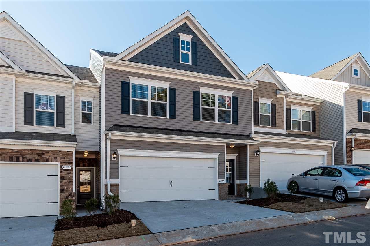 6339 Grace Lily Drive, Unit 18 Raleigh, NC 27607 - Photo 1 of 23 a view of a car park in front of house