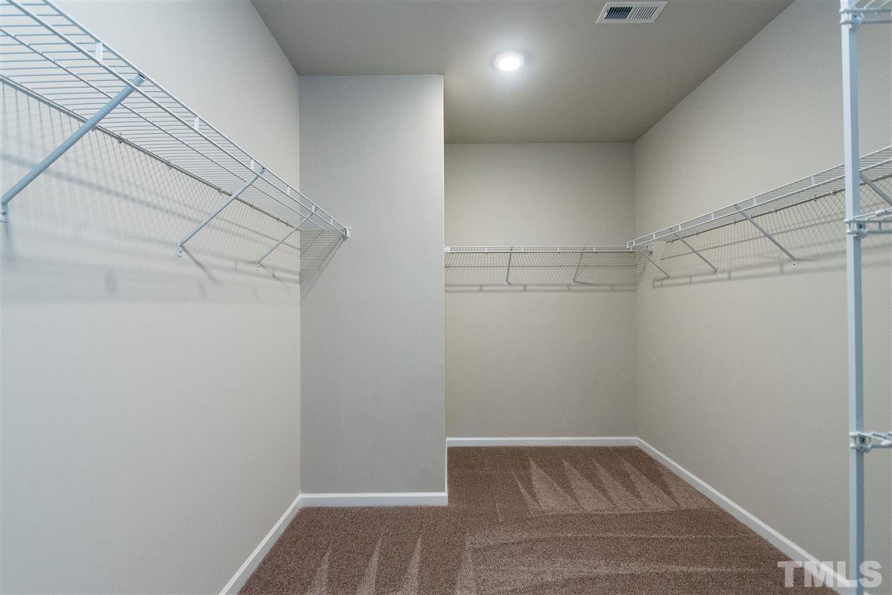 6339 Grace Lily Drive, Unit 18 Raleigh, NC 27607 - Photo 13 of 23 a view of a room with racks on the wall