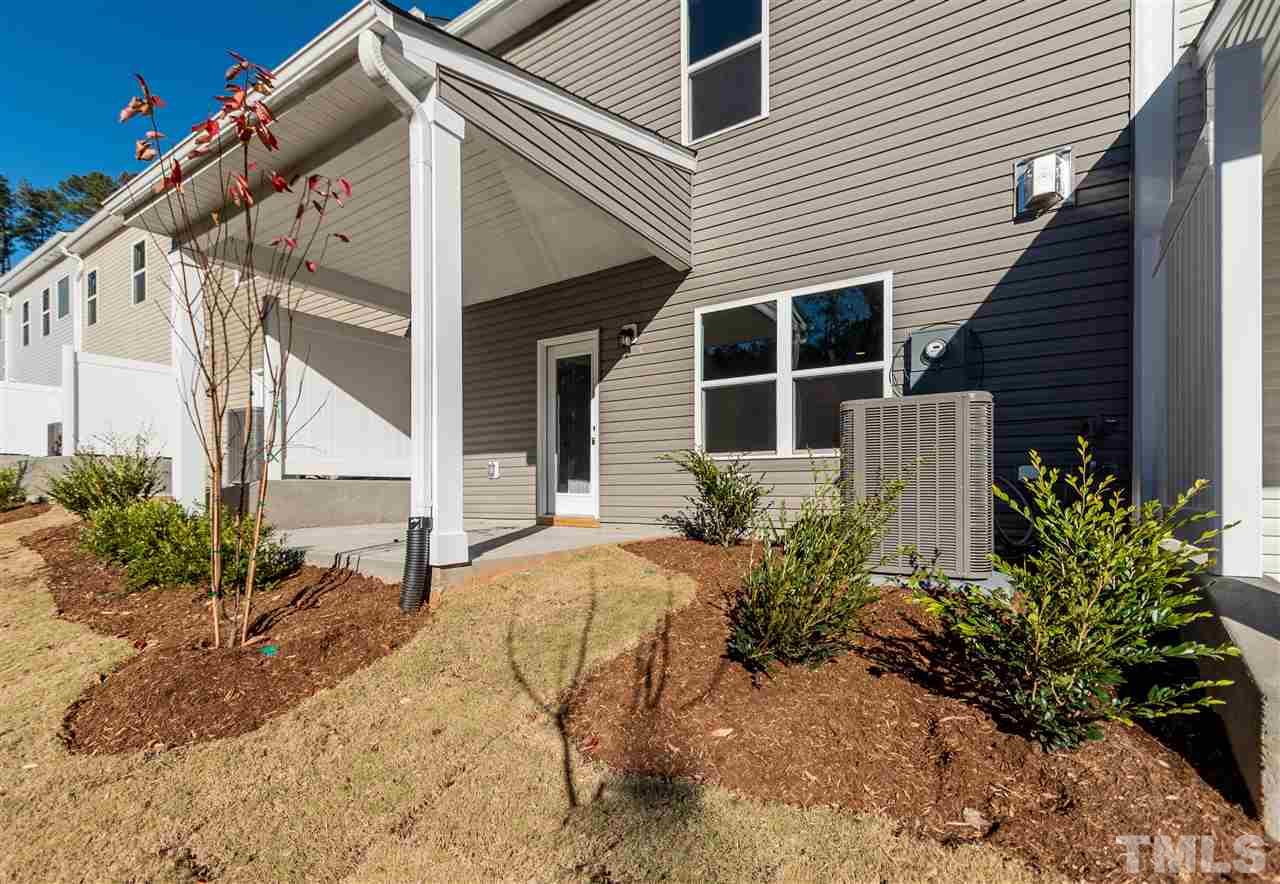 6339 Grace Lily Drive, Unit 18 Raleigh, NC 27607 - Photo 16 of 23 front view of a house with a yard