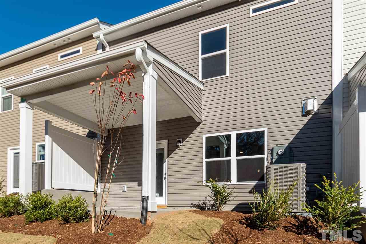6339 Grace Lily Drive, Unit 18 Raleigh, NC 27607 - Photo 17 of 23 a front view of a house with plants