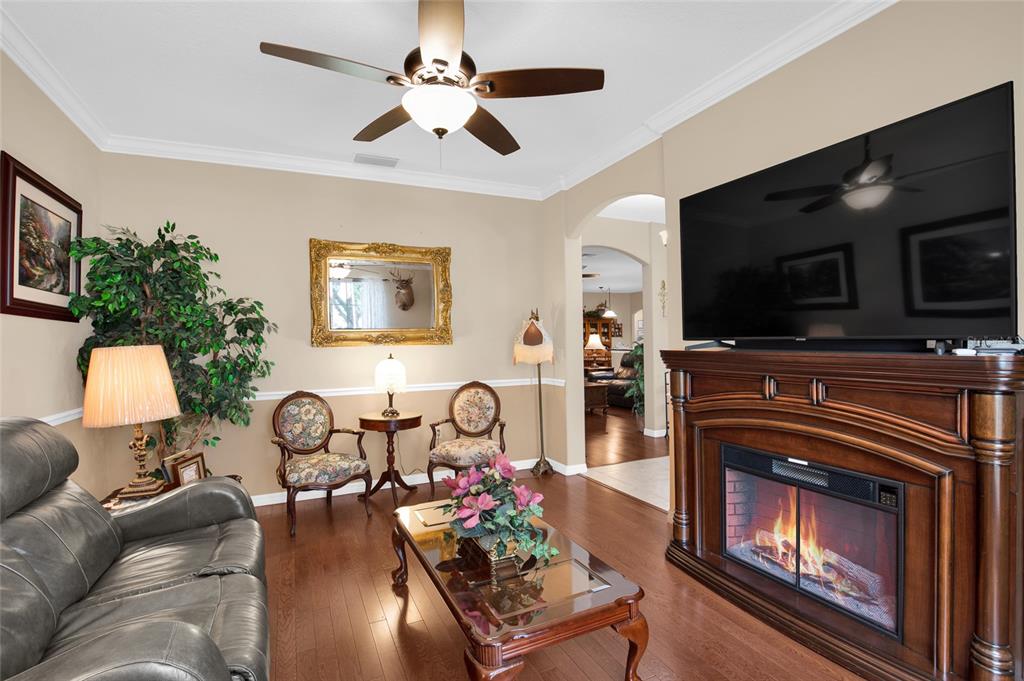16411 Southwest 14th Avenue Road Ocala, FL 34473 - Photo 7 of 59 a living room with furniture and a flat screen tv