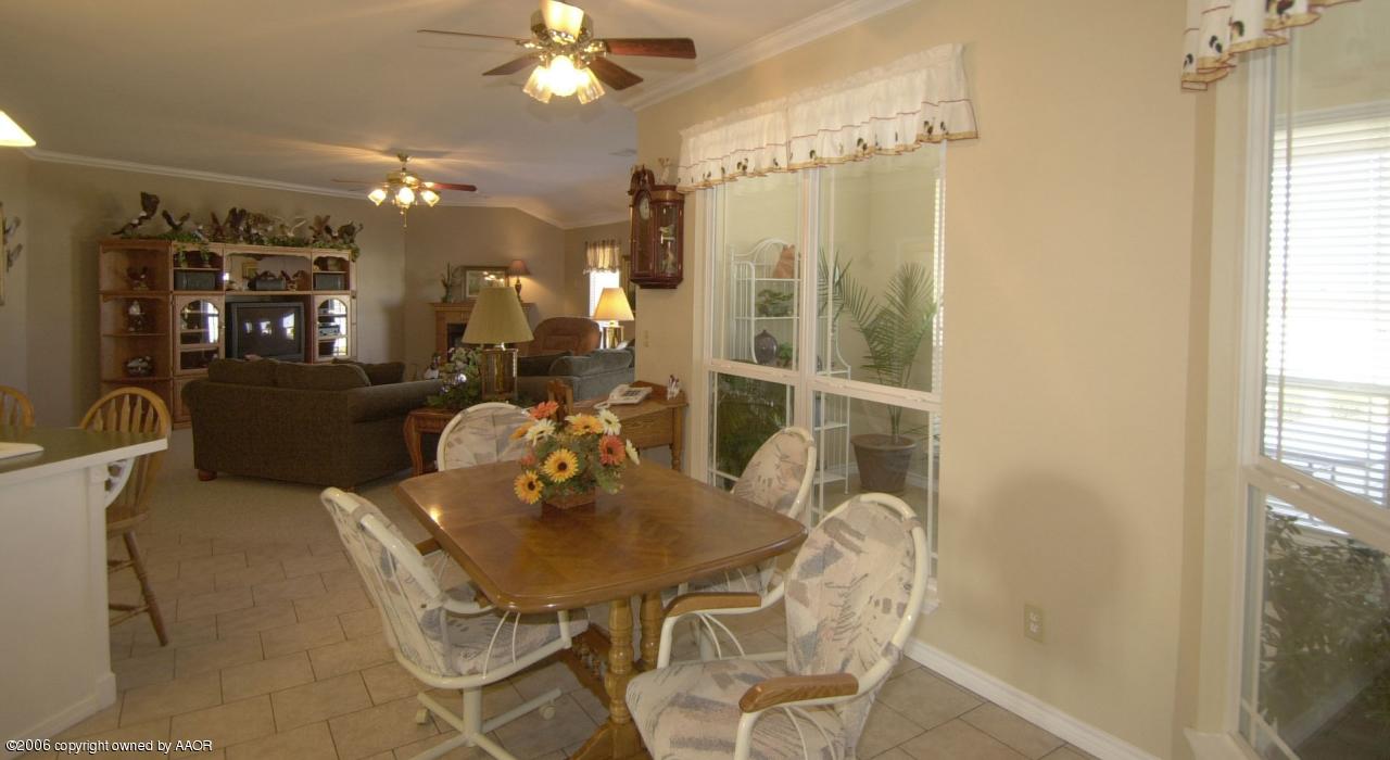8800 Red Wing Road Amarillo, TX 79119 - Photo 5 of 15 a view of a dining room with furniture and chandelier