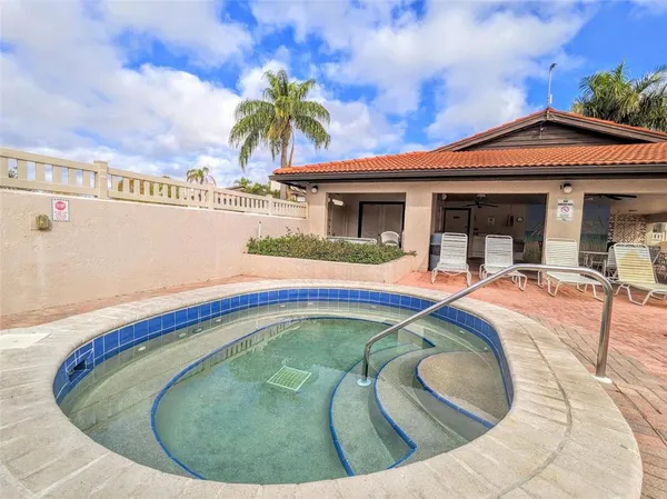 a view of swimming pool with a house