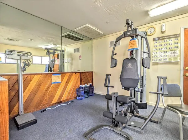 a view of gym equipment and windows