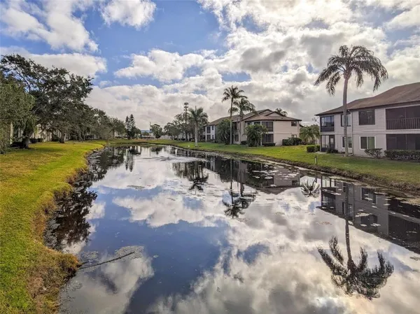 a view of a lake with a yard